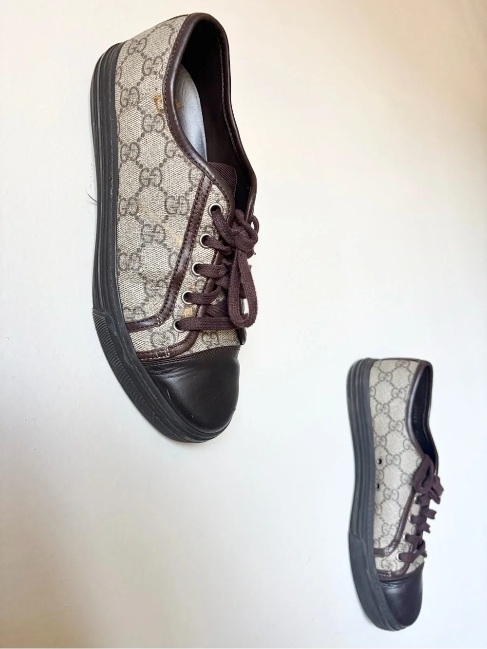 Gucci Men’s GG Canvas Low-Top Sneakers in Brown and Black